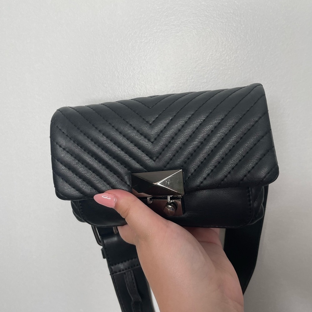 Black Waist bag with adjustable strap.